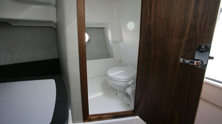 Separate toilet compartment with solid walnut frame and lockable door